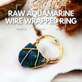 Raw aquamarine wire-wrapped ring, promoting courage, clarity, and serenity.