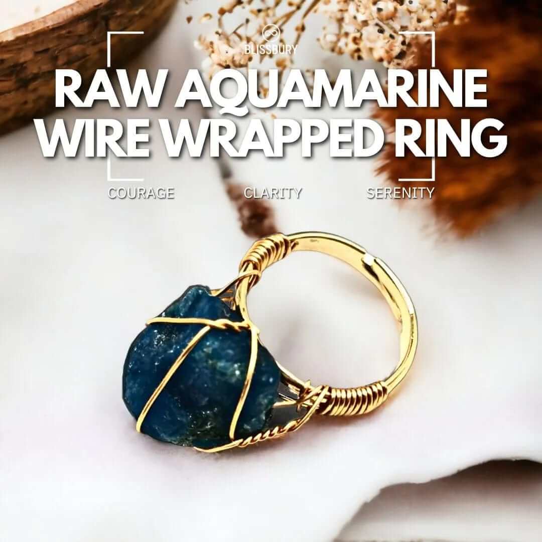 Raw aquamarine wire-wrapped ring, promoting courage, clarity, and serenity.