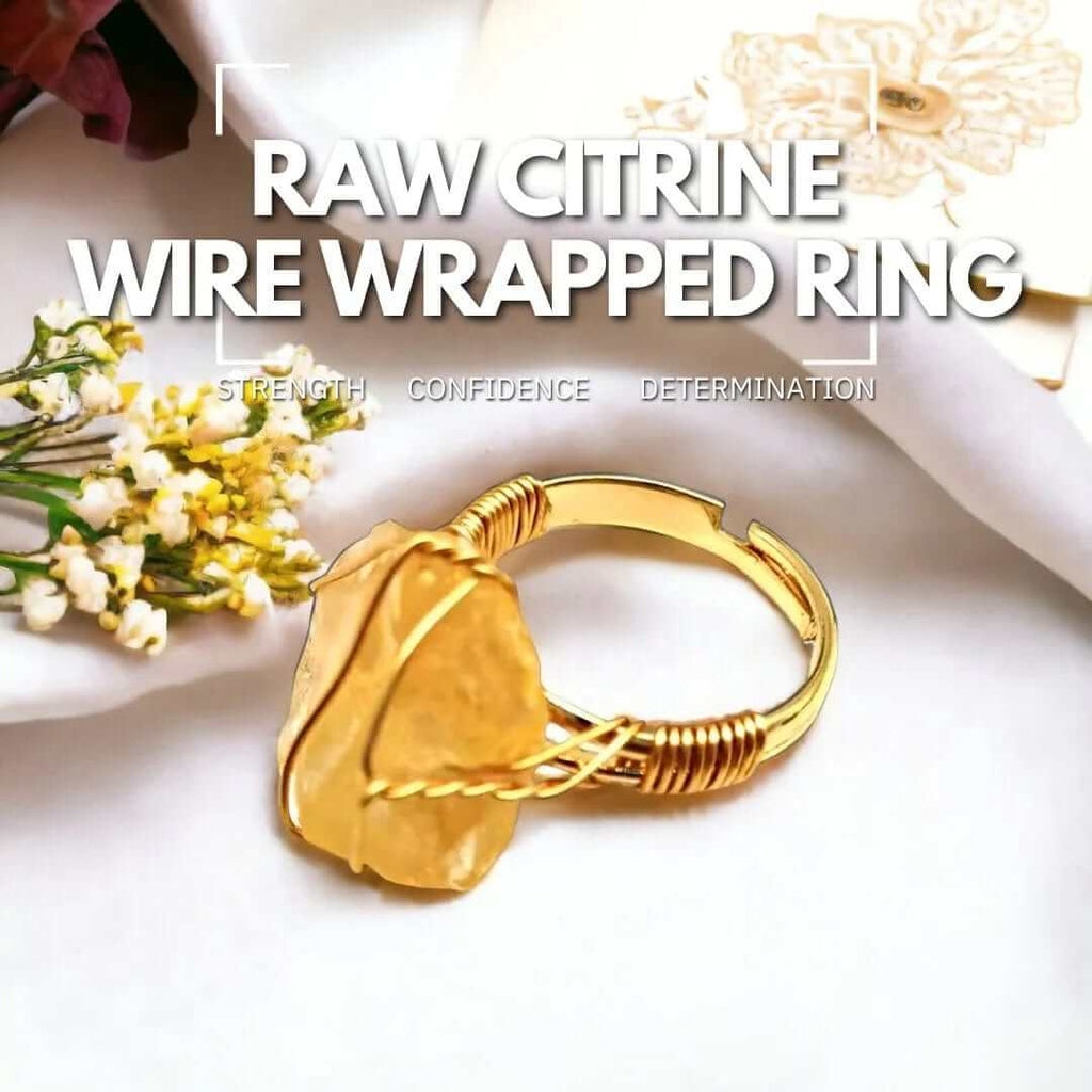 Raw citrine wire-wrapped ring, featuring a warm, golden stone accented by silver wire, symbolizing warmth and prosperity.