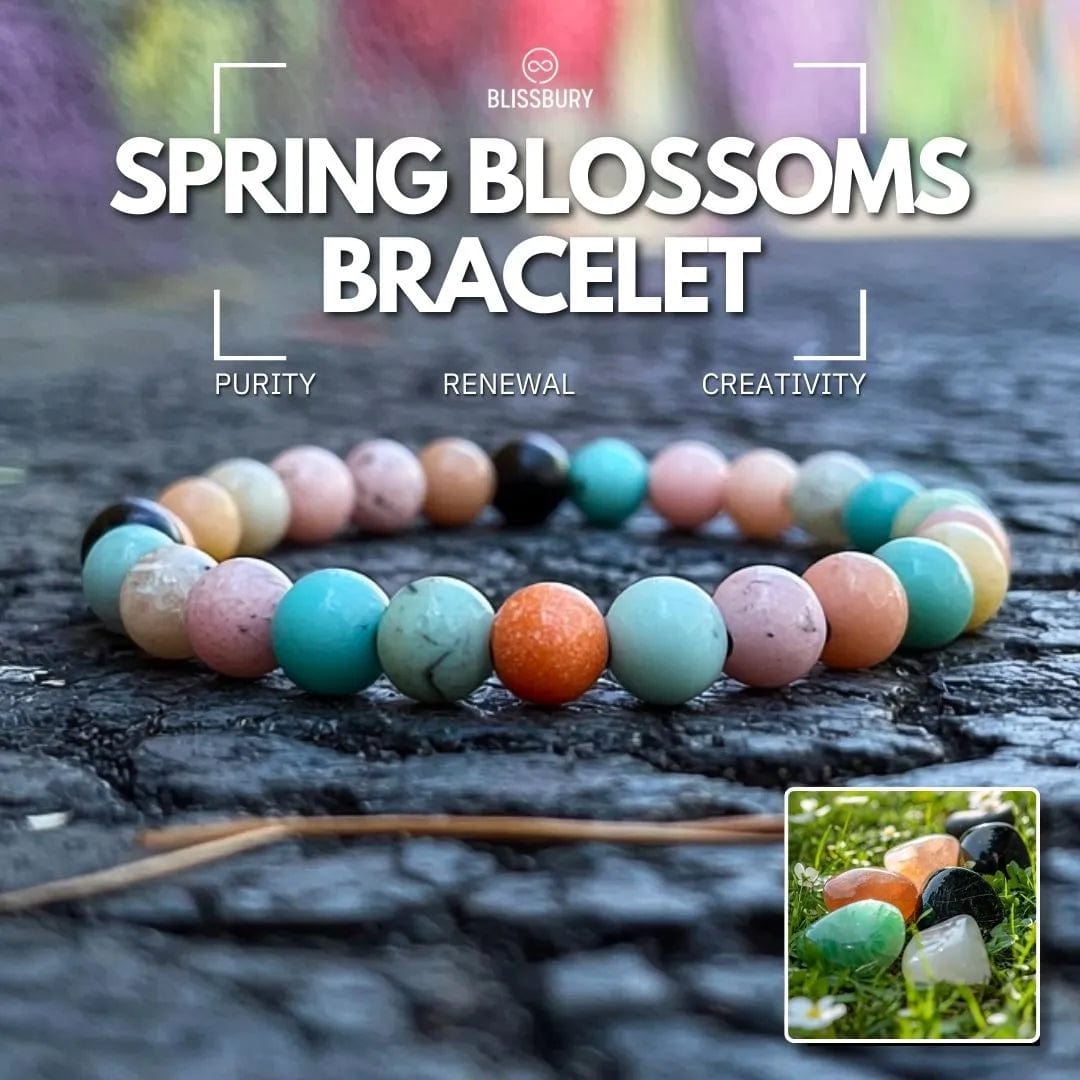 Spring Blossoms Bracelet - Purity, Renewal, Creativity. Delicate silver bracelet with floral charms and white pearl accents.
